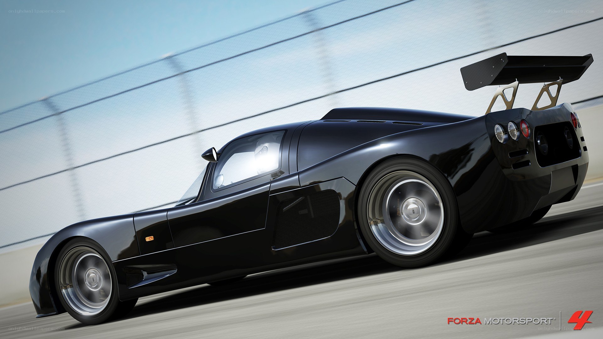 black race car on track