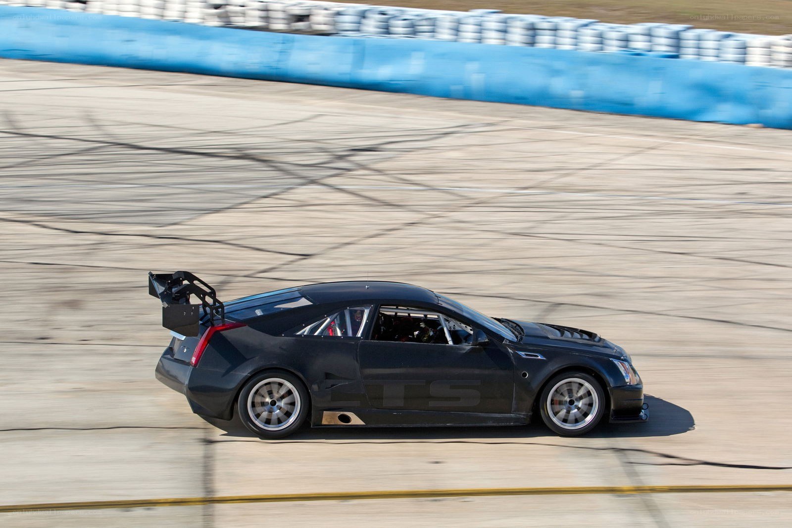 black race car on track