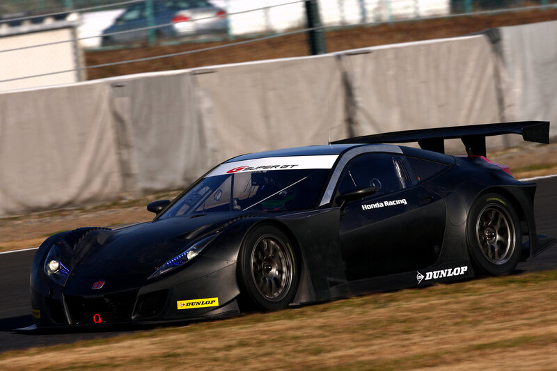 black race car on track