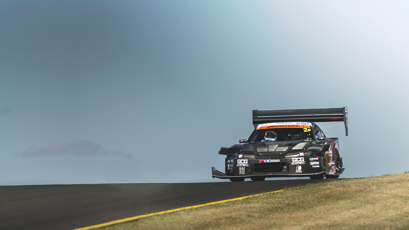 Black Race Car on Track — Dramatic, Afternoon, Photograph, Race Car