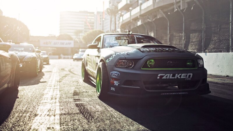 Black Race Car on Track — Dramatic, Afternoon
