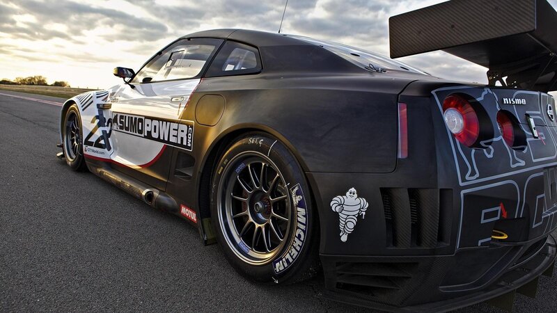 Black Race Car on Track — Dramatic, Sunset, Photograph, Race Car, Tire