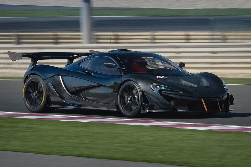 Black Race Car on Track — Dynamic, Afternoon, Photograph, Driver, Grass