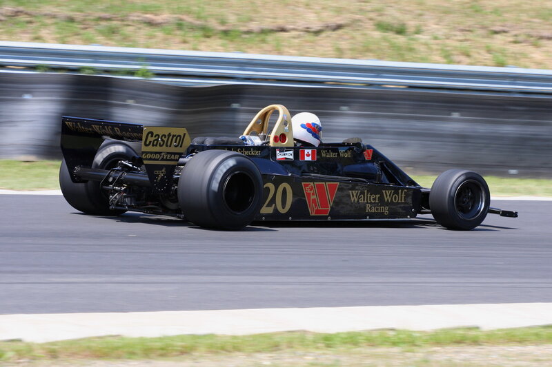 Black Race Car on Track — Dynamic, Afternoon, Photograph, Driver, Race Car