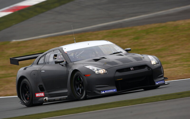 Black Race Car on Track — Dynamic, Afternoon, Photograph, Race Car, Grass