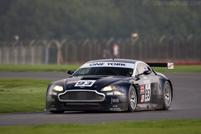 Black Race Car on Track — Dynamic, Afternoon, Photograph, Race Car