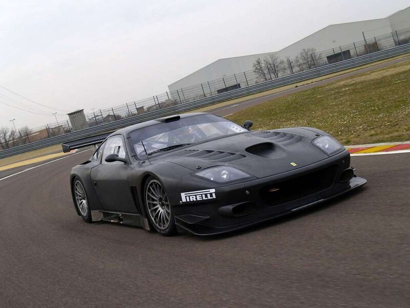 Black Race Car on Track — Dynamic, Afternoon, Photograph, Race Track, Building