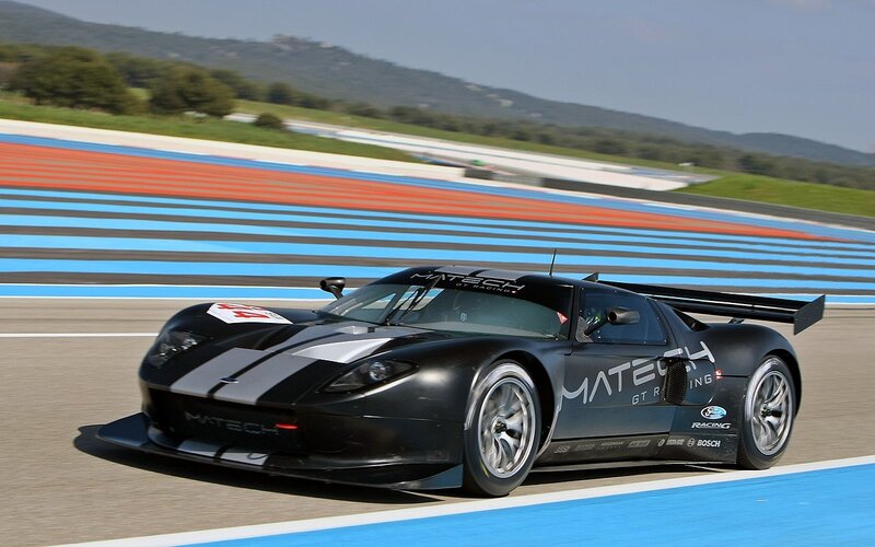 Black Race Car on Track — Dynamic, Afternoon, Photograph, Race Track, Mountains