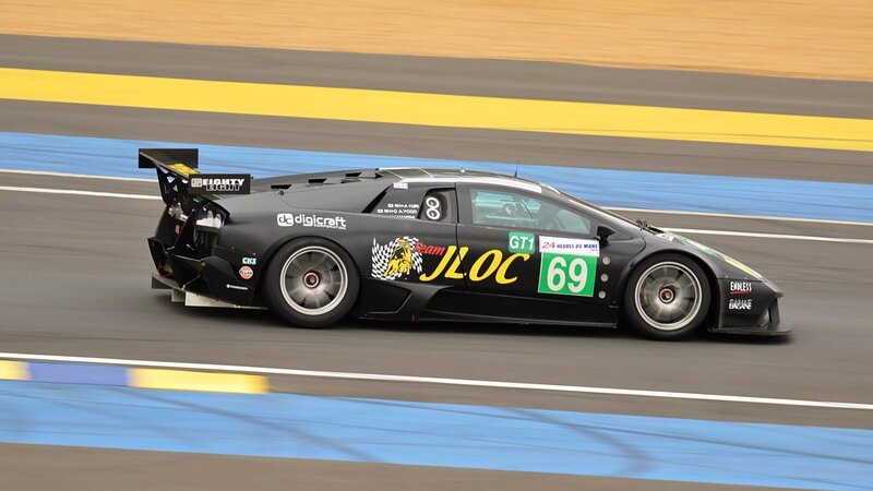 Black Race Car on Track — Dynamic, Photograph, Race Car, Number 69