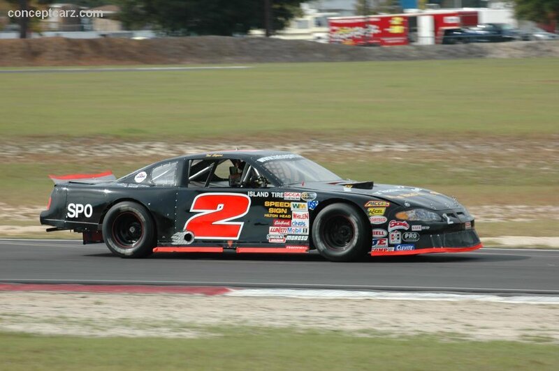 Black Race Car on Track — Dynamic