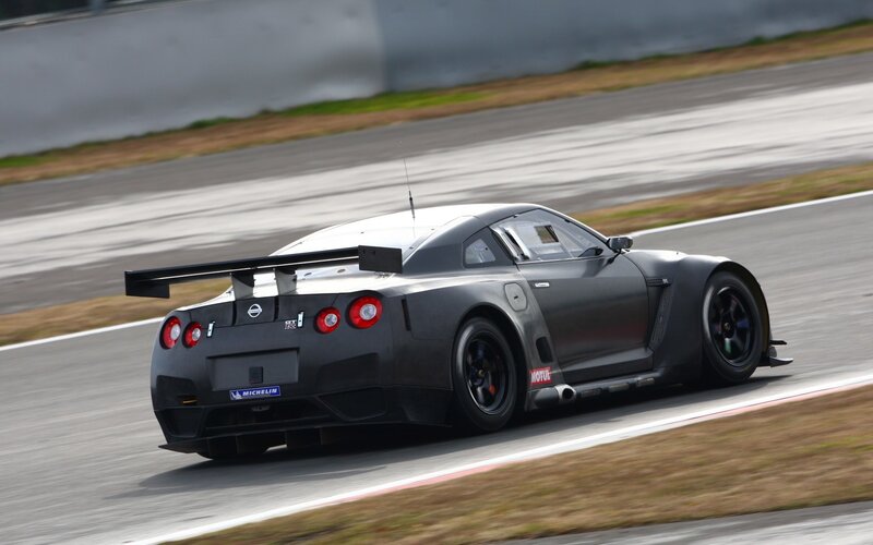 Black Race Car on Track — Gray, Dynamic, Photograph, Race Car, Tire