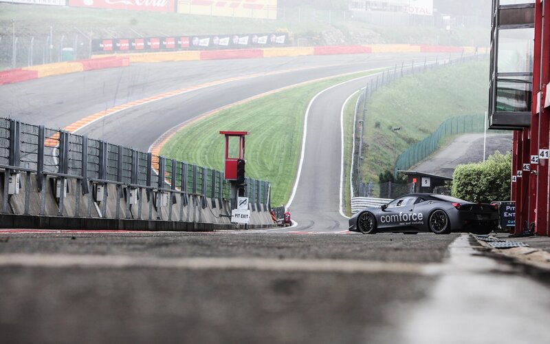 Black Race Car on Track — Gray, Overcast