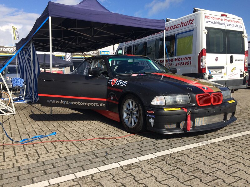 Black Race Car — Outdoor, Afternoon, Photograph, Tent