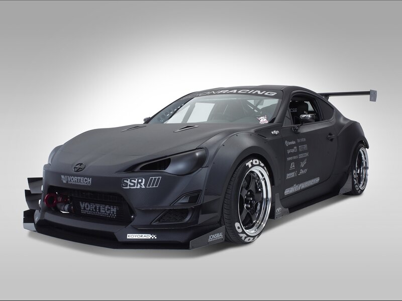 black race car with carbon fiber body