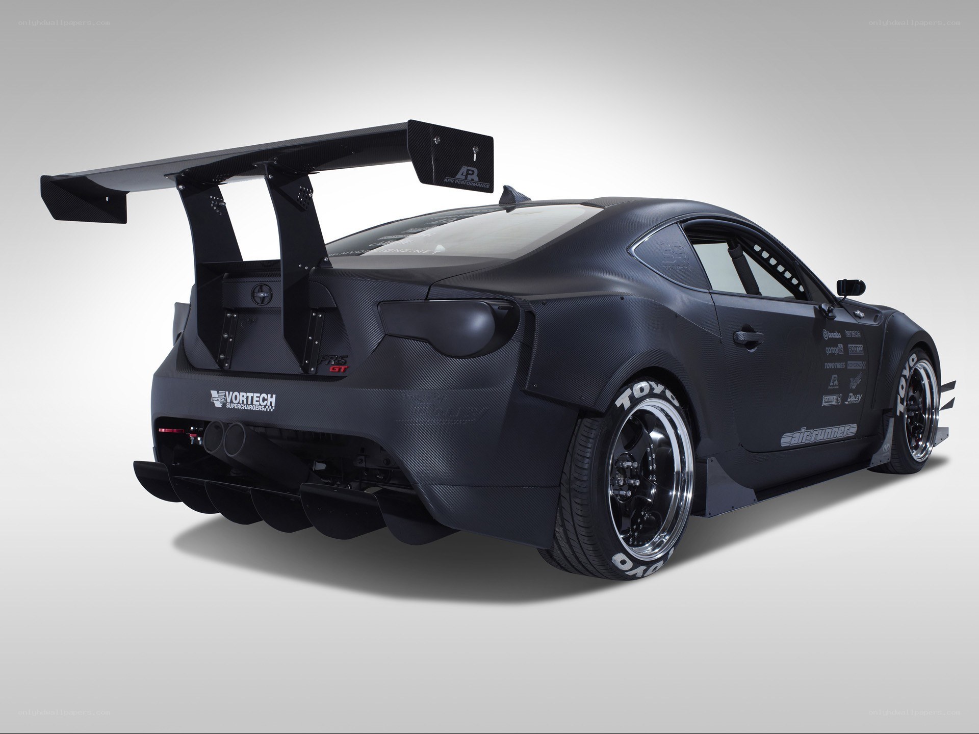 black race car with large wing