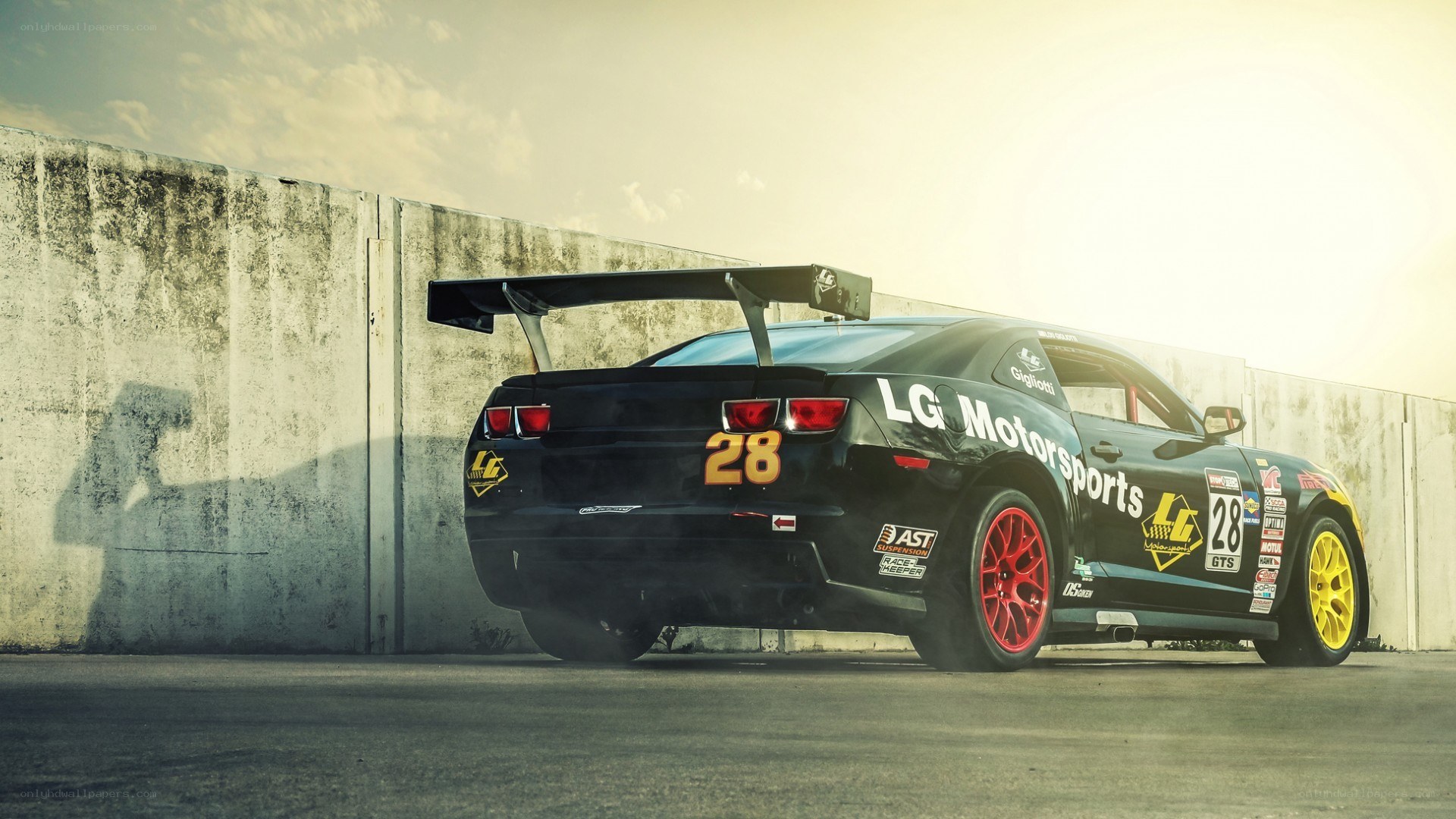 black race car with number 28