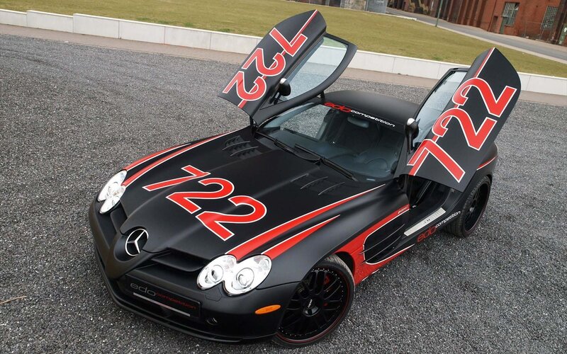 Black race car with open doors