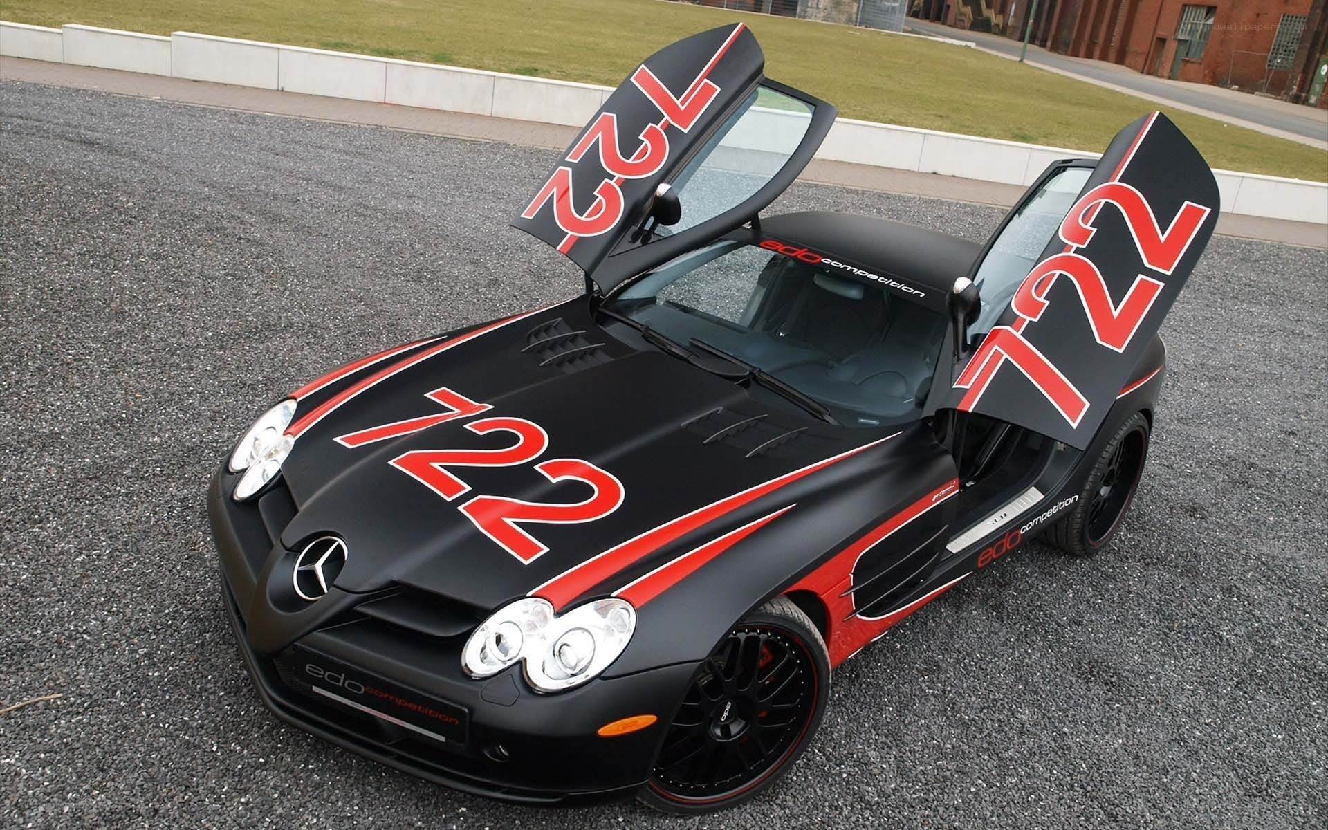 Black race car with open doors