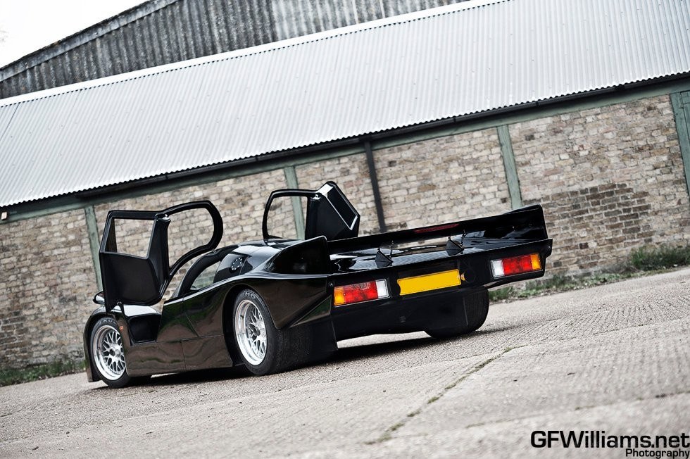 black race car with open doors