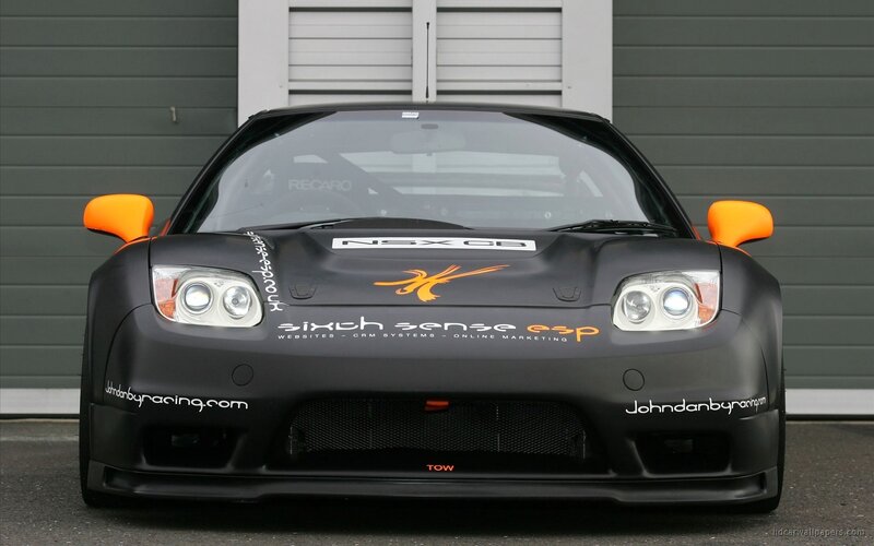 black race car with orange accents