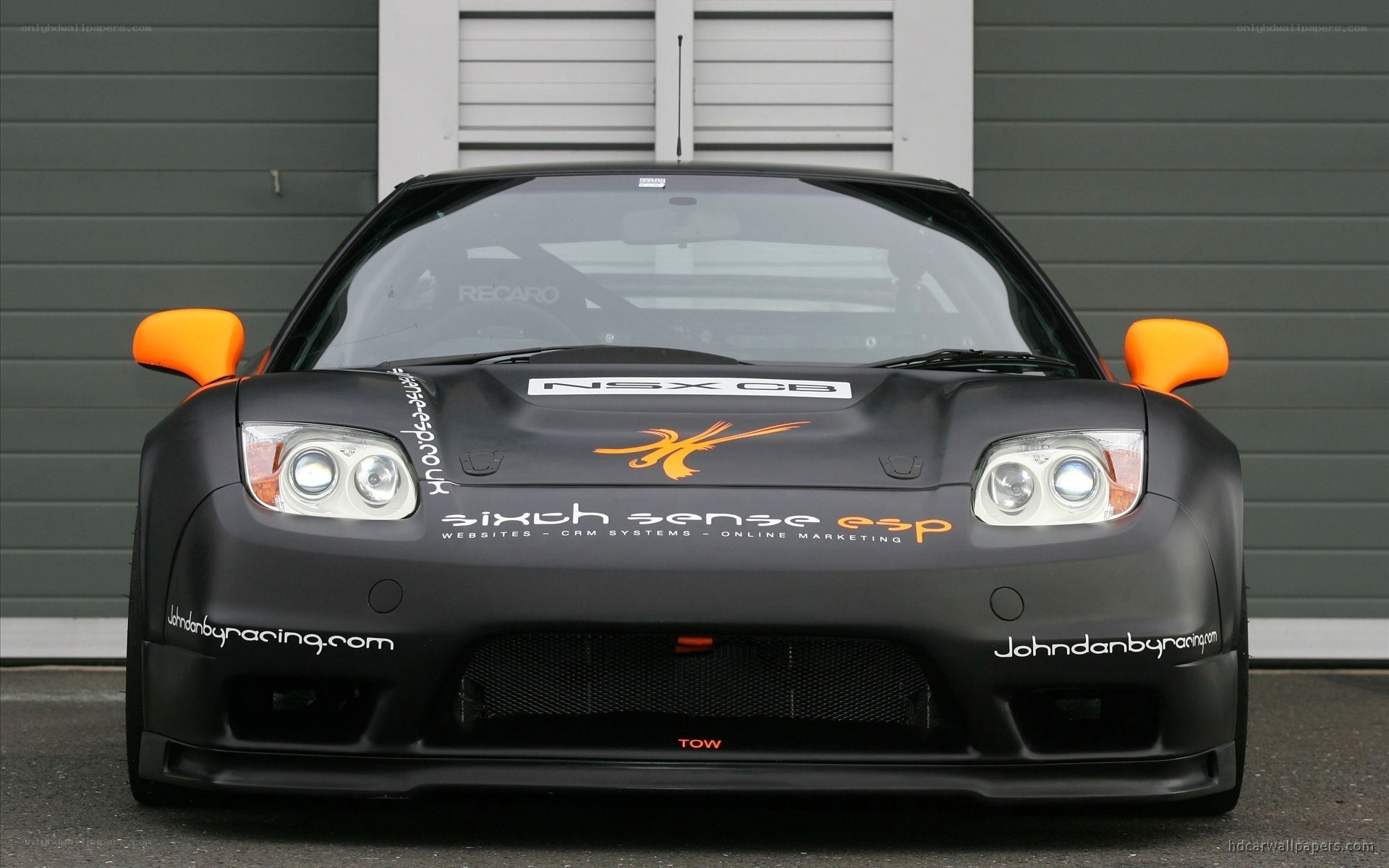 black race car with orange accents