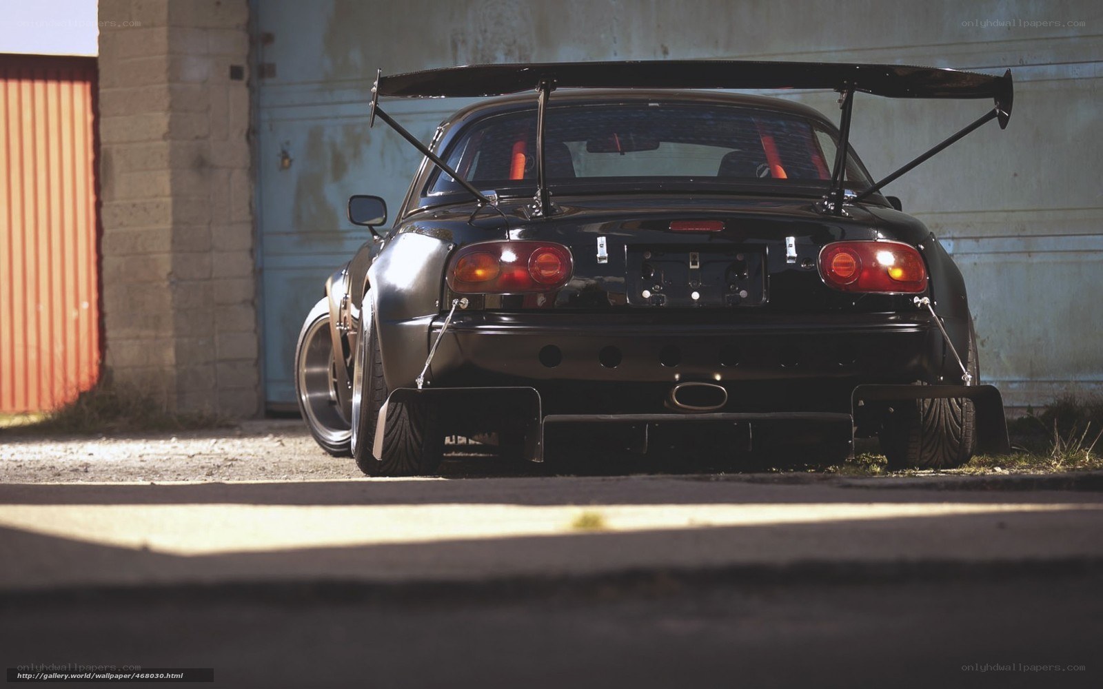 black race car with rear wing