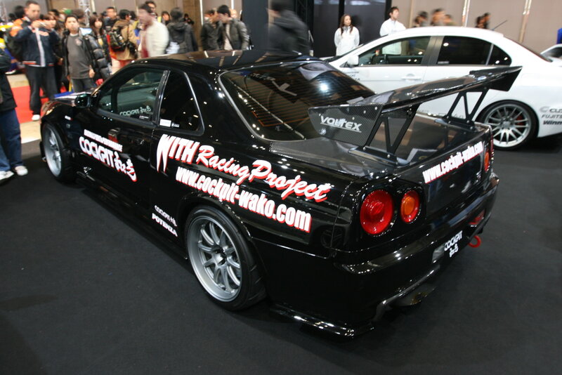 Black racing car at auto show