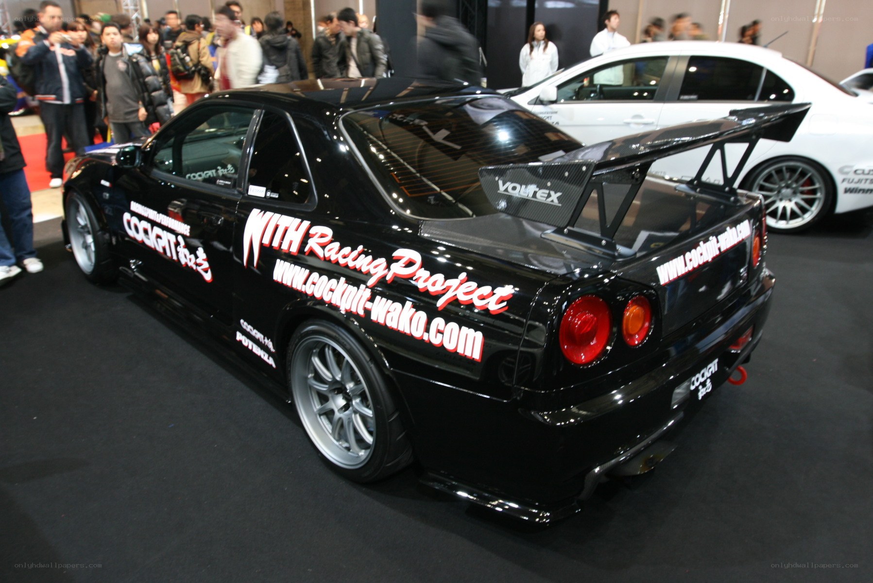 Black racing car at auto show
