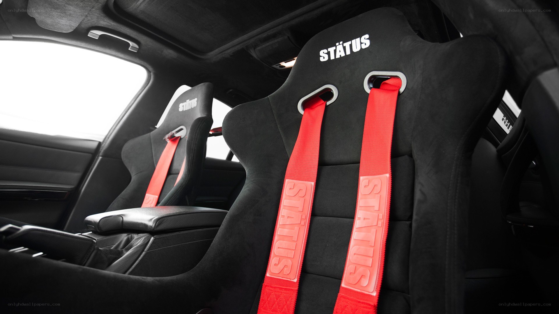 black racing seats with red straps