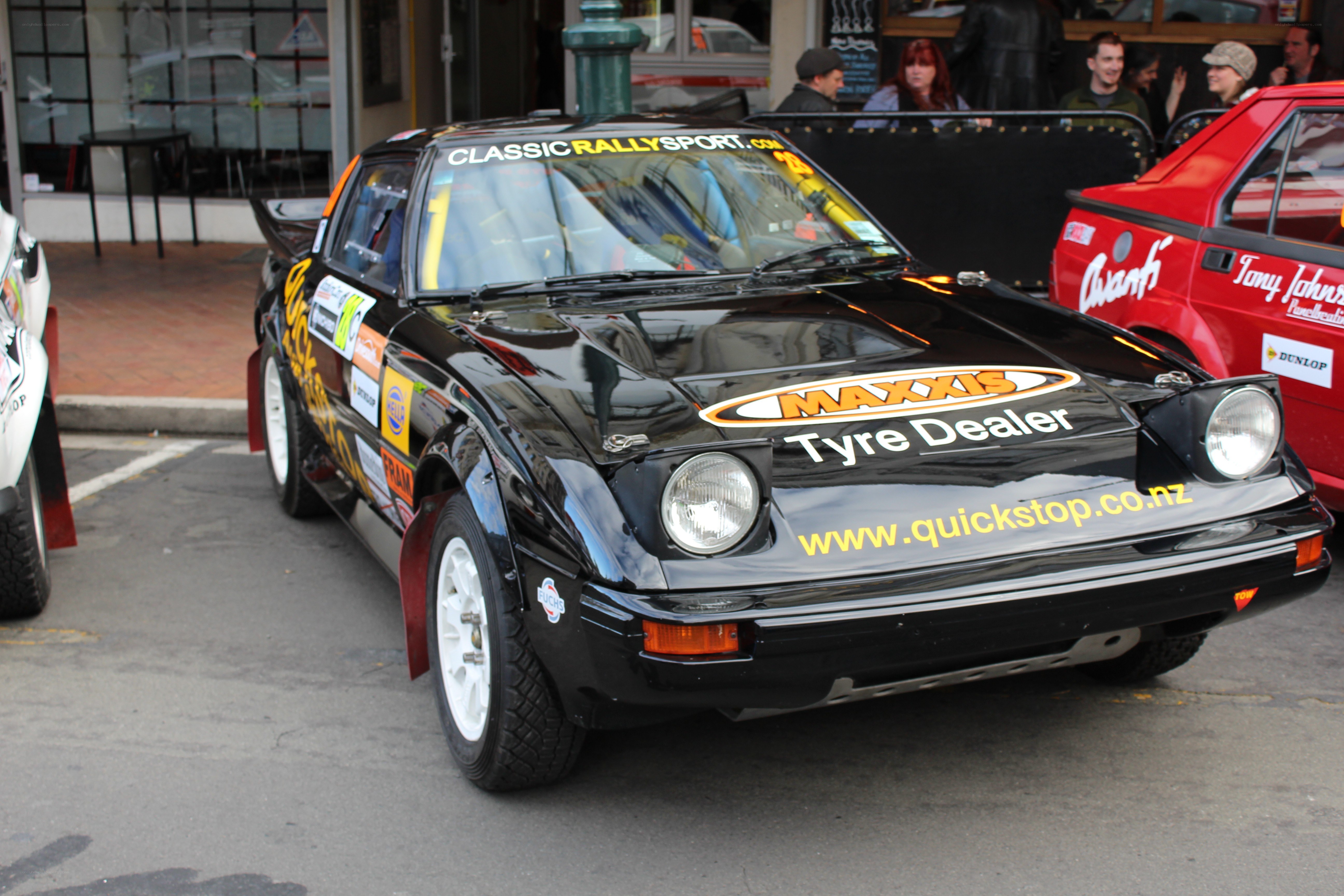 Black rally car on display
