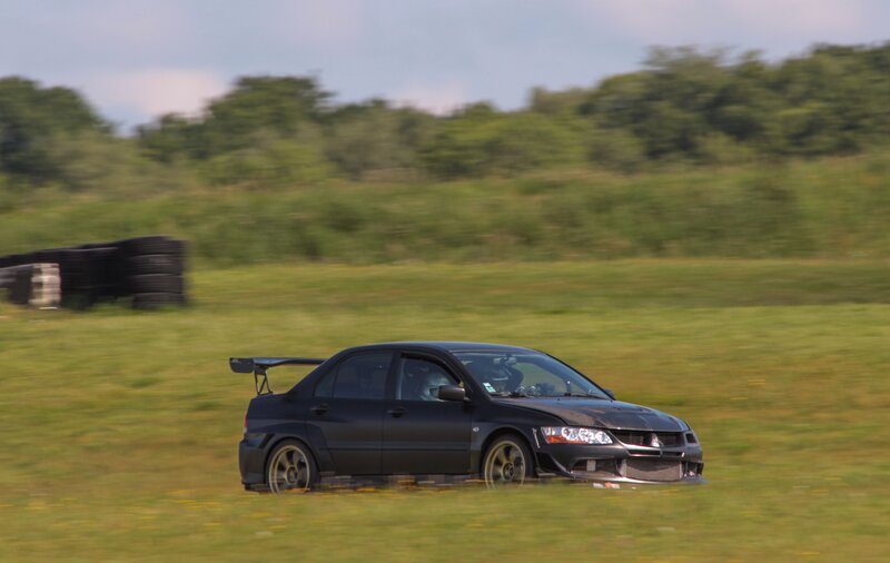 Black Rally Car on Grass