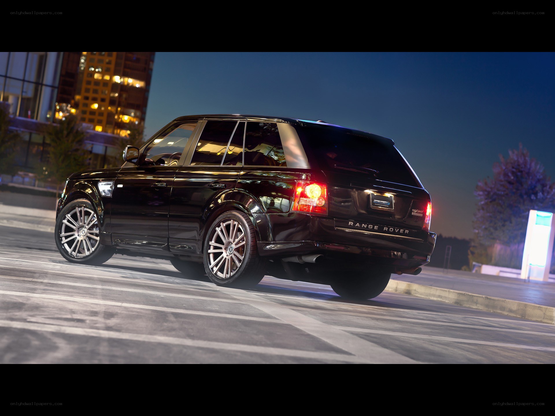 black range rover at night