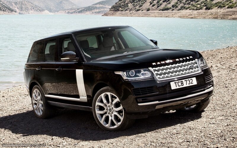 Black Range Rover by a lake