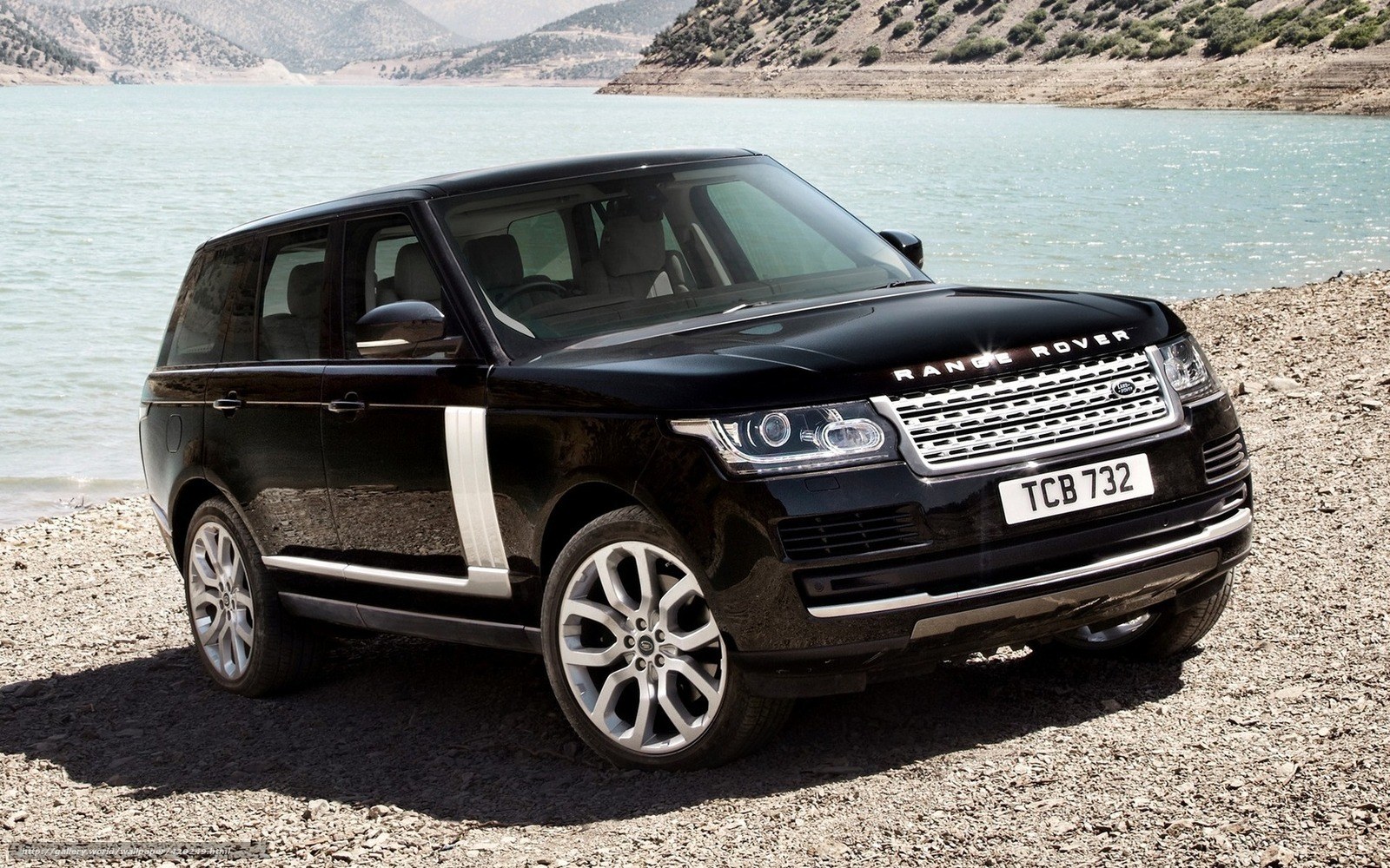 Black Range Rover by a lake