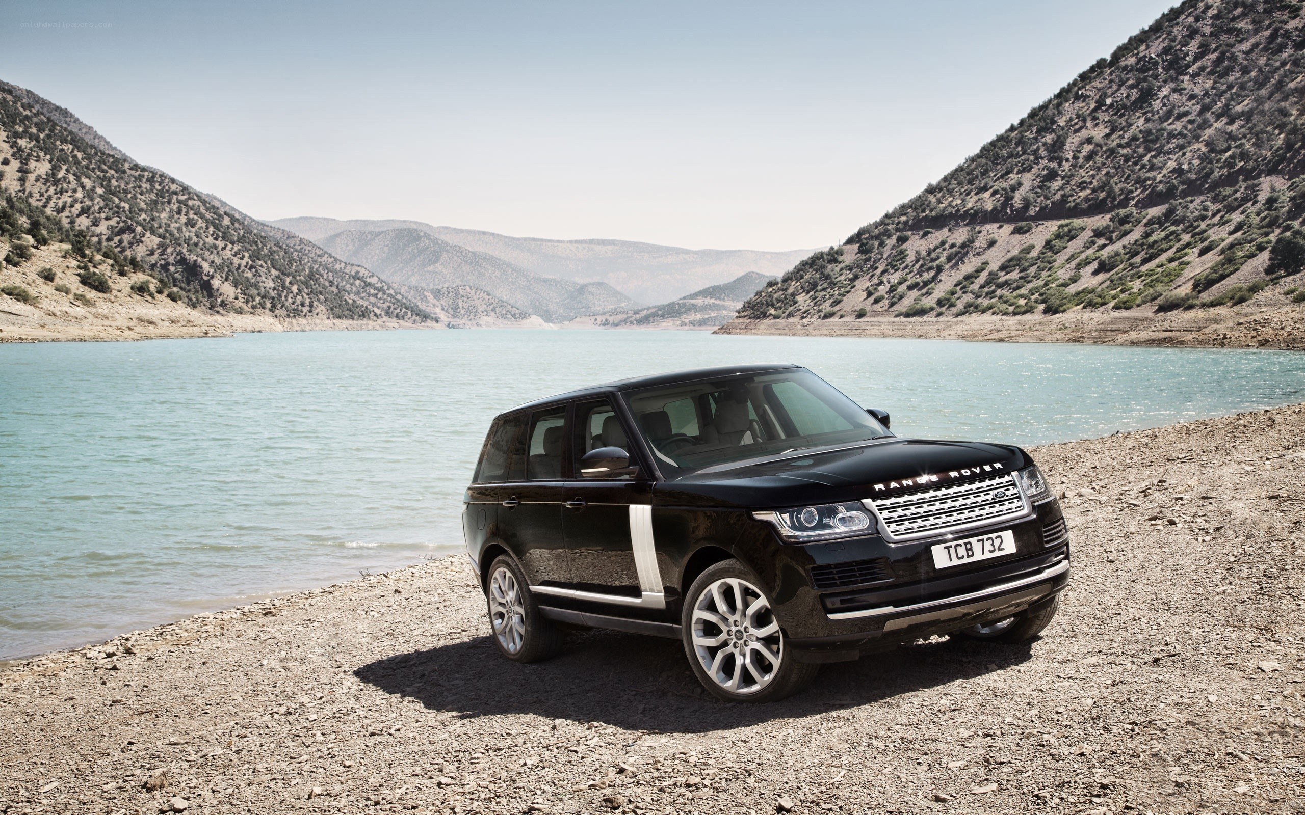 Black Range Rover by a lake