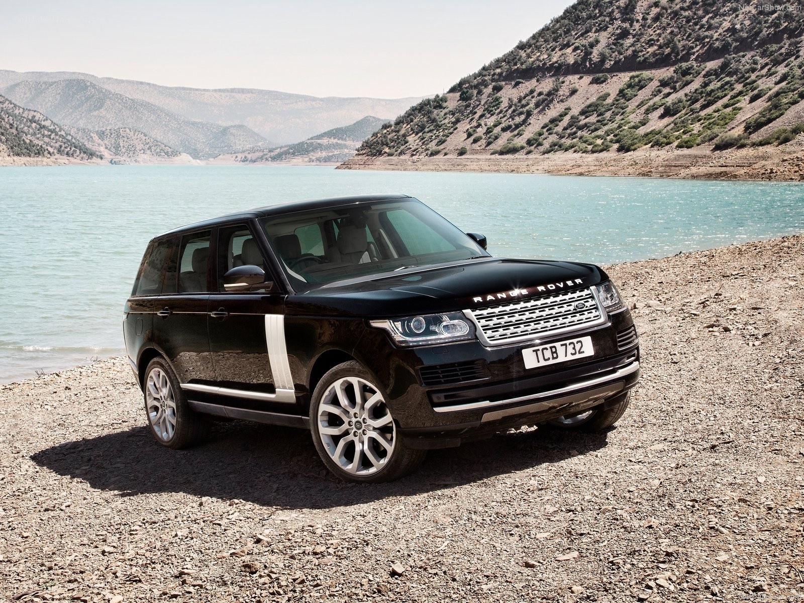 Black Range Rover by a lake