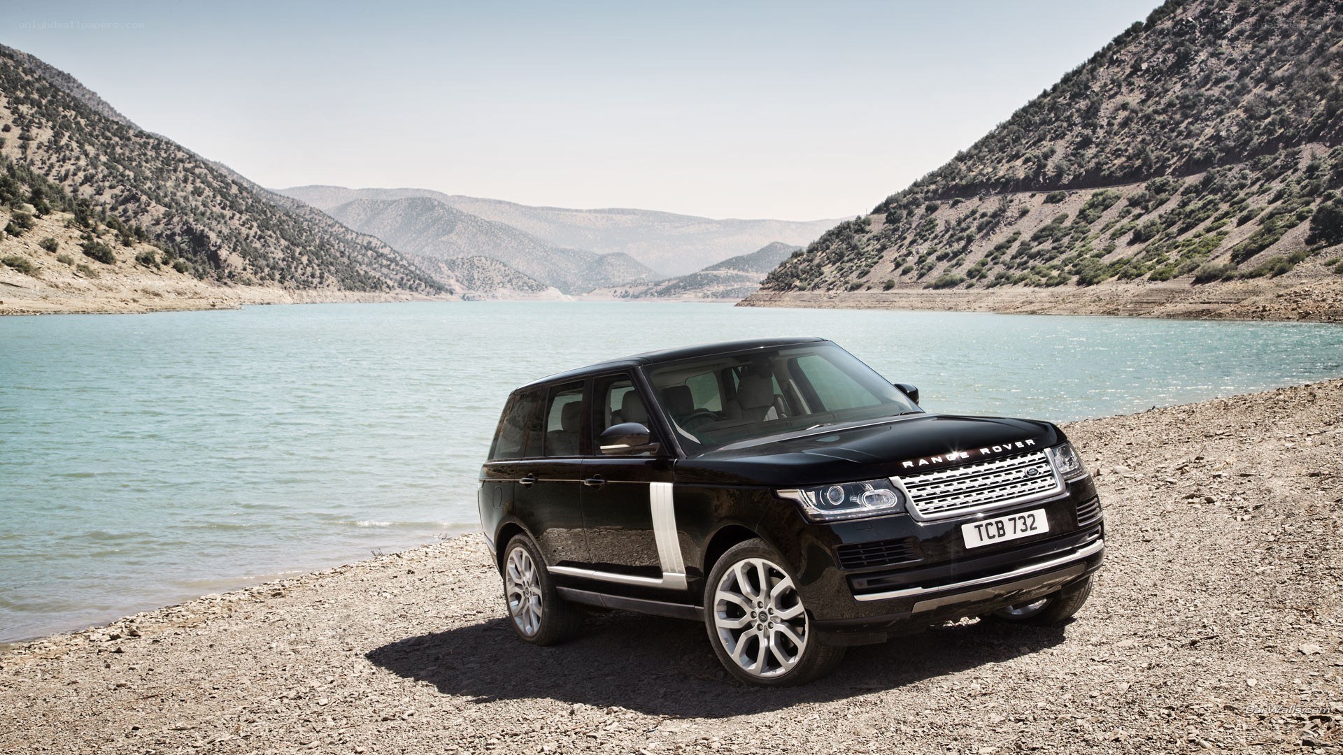 Black Range Rover by a lake