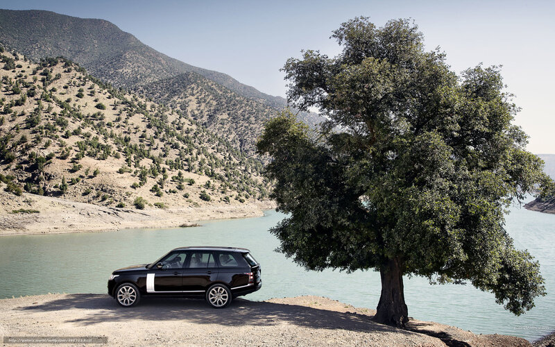 Black Range Rover by a lake