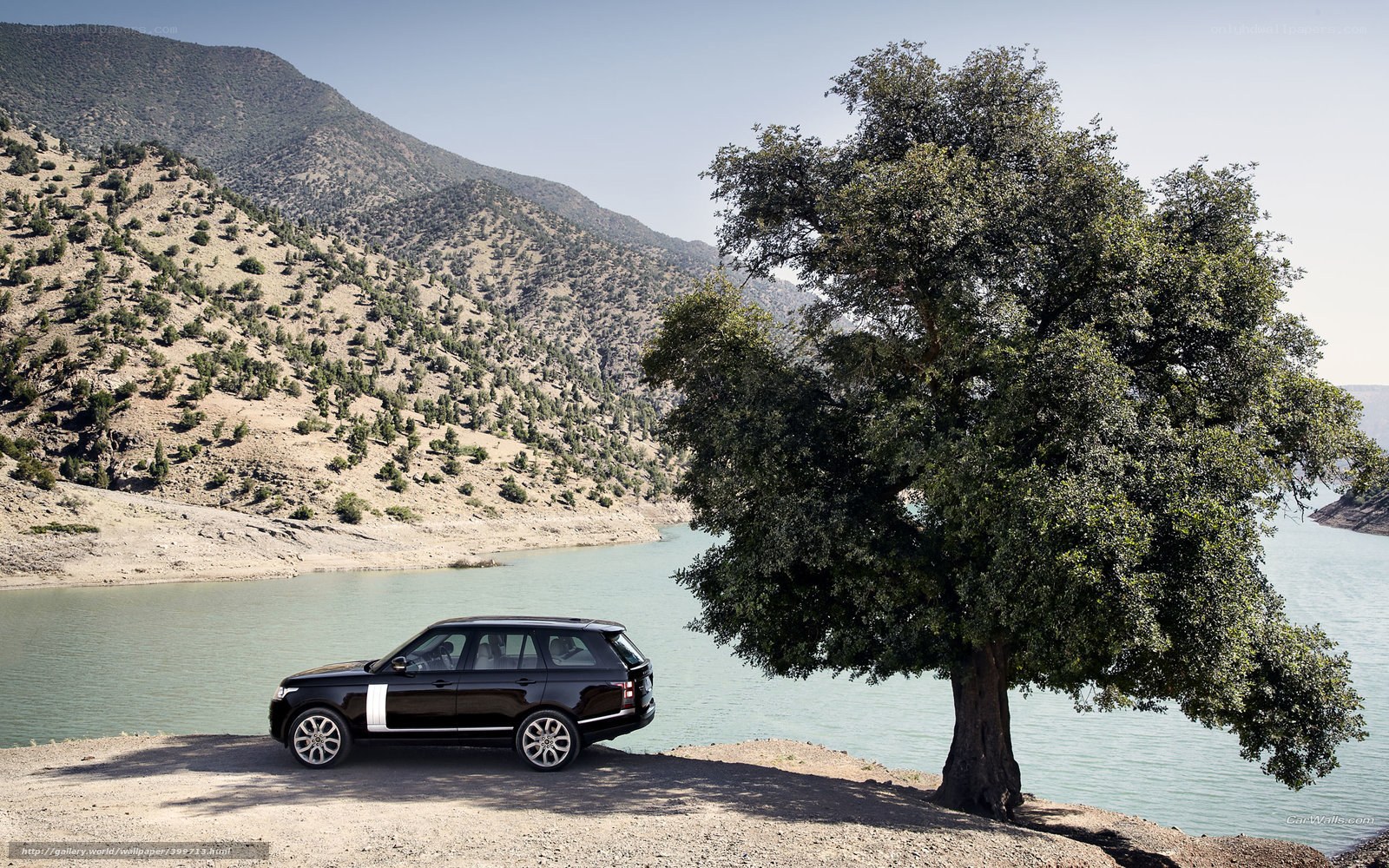 Black Range Rover by a lake