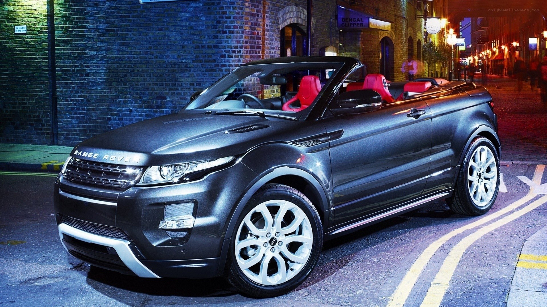 Black Range Rover convertible at night