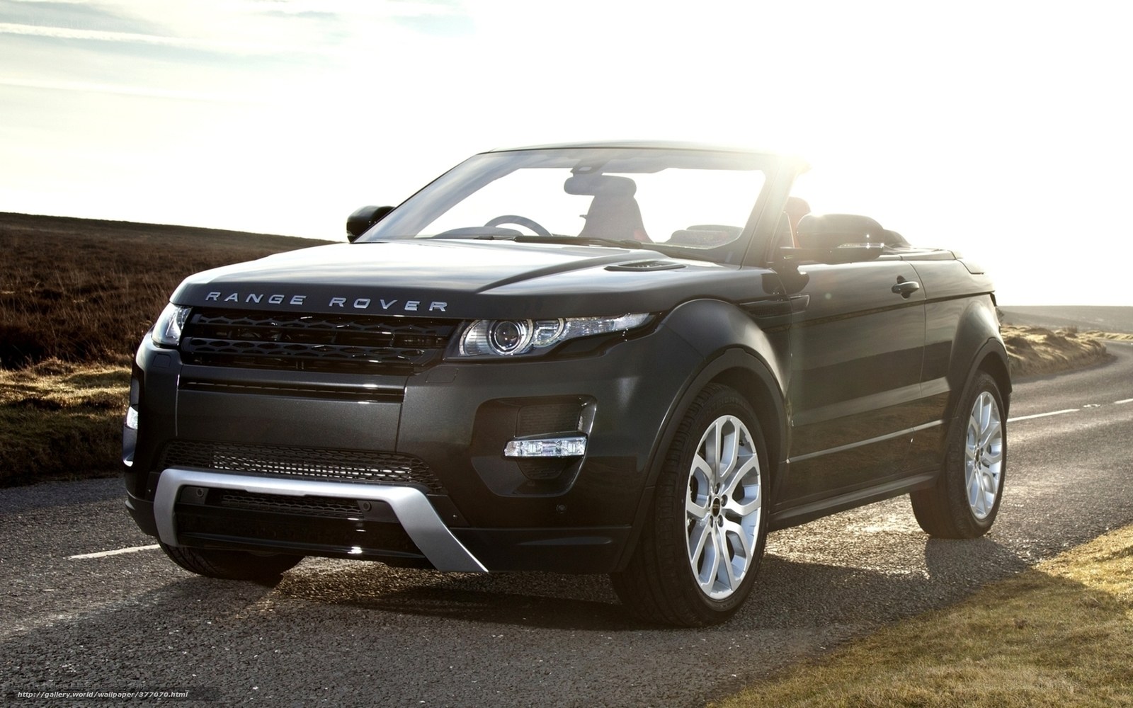 Black Range Rover convertible on road