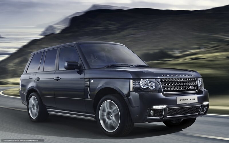 Black Range Rover driving on road