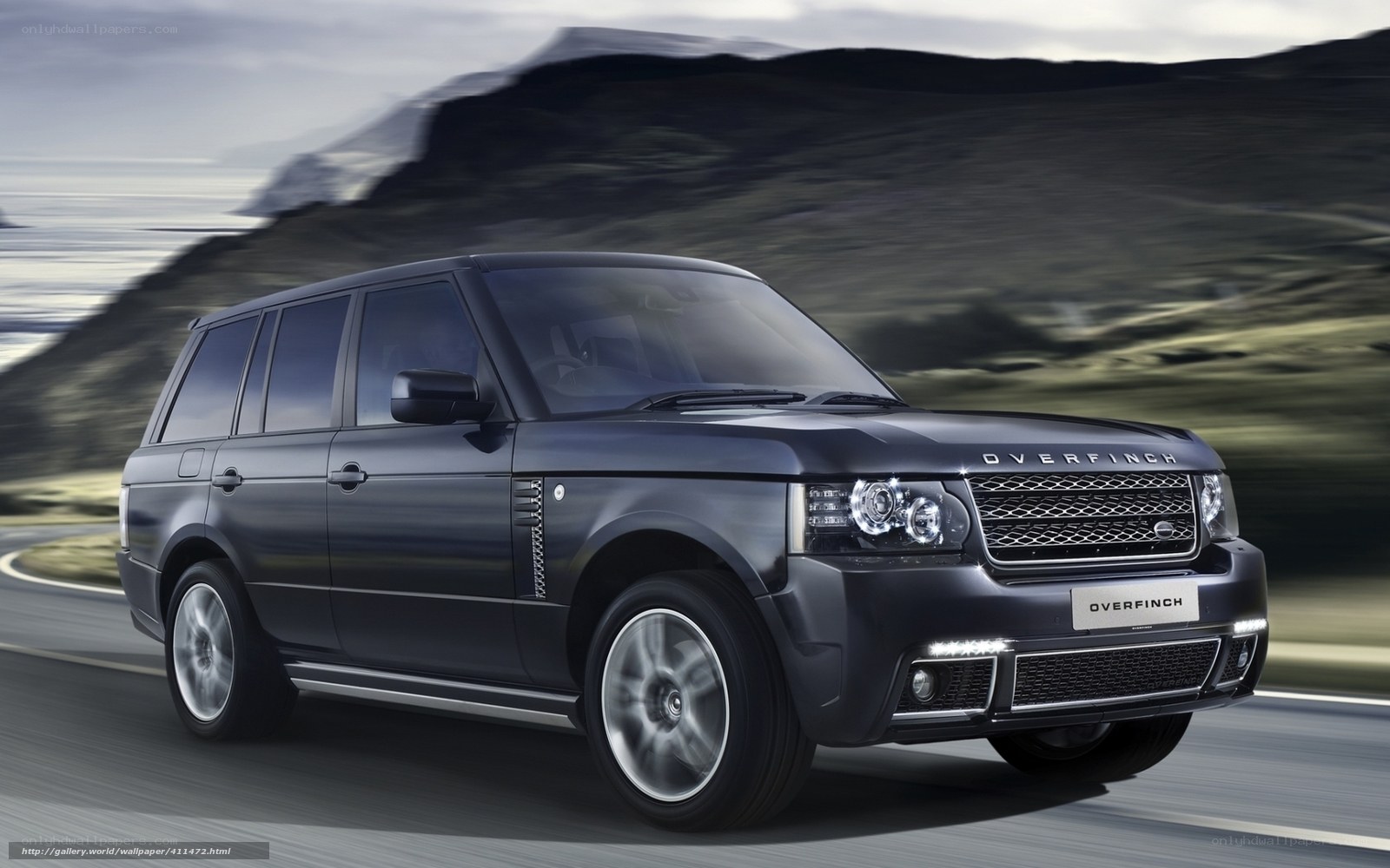 Black Range Rover driving on road
