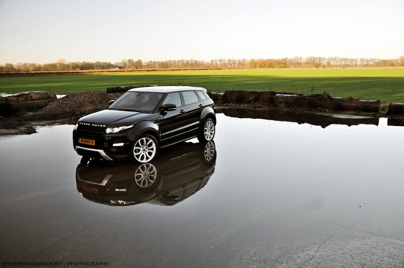 Black Range Rover in a puddle