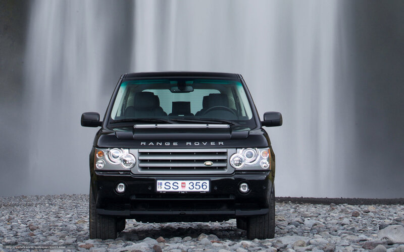 Black Range Rover in front of waterfall