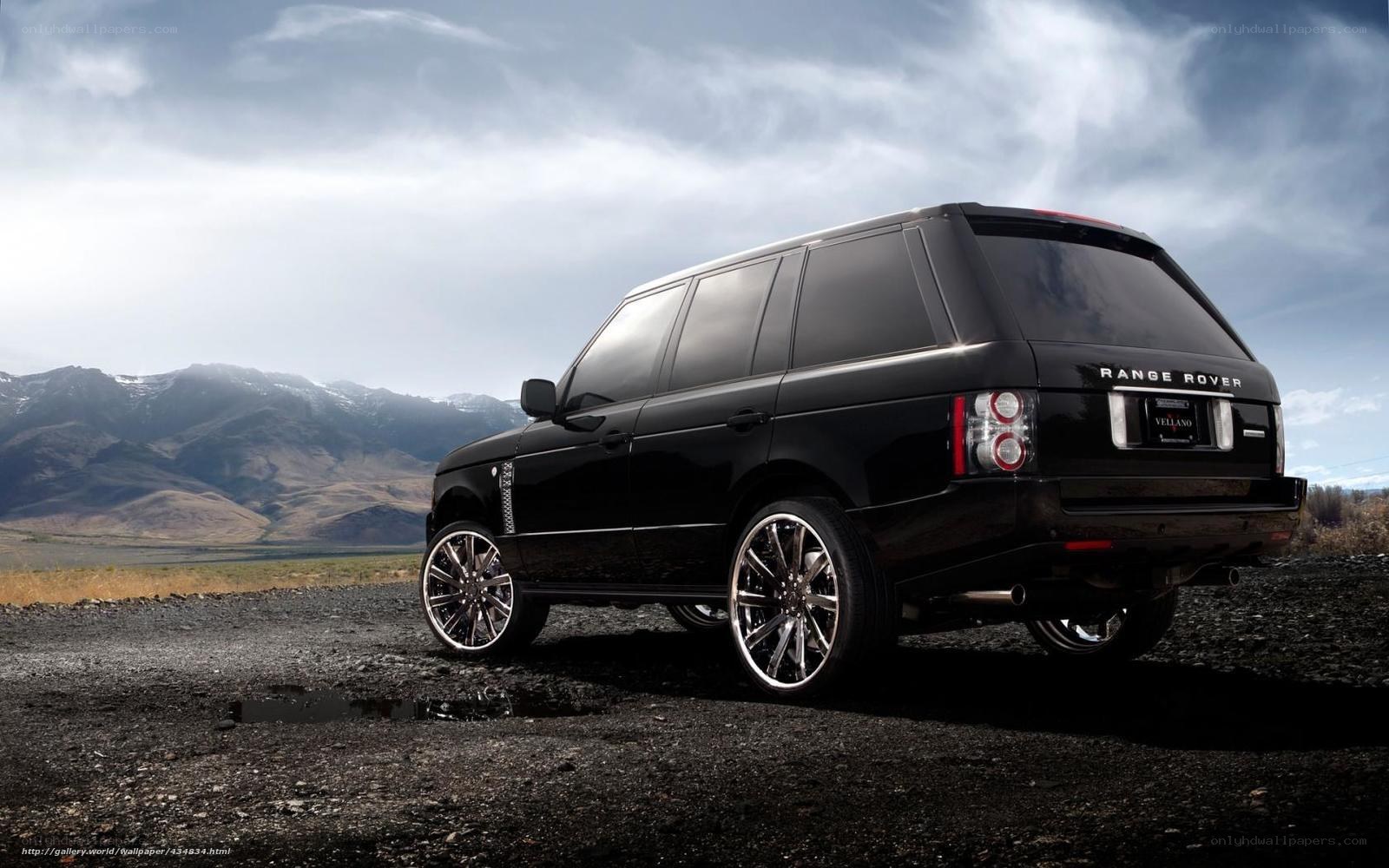 Black Range Rover in mountain landscape