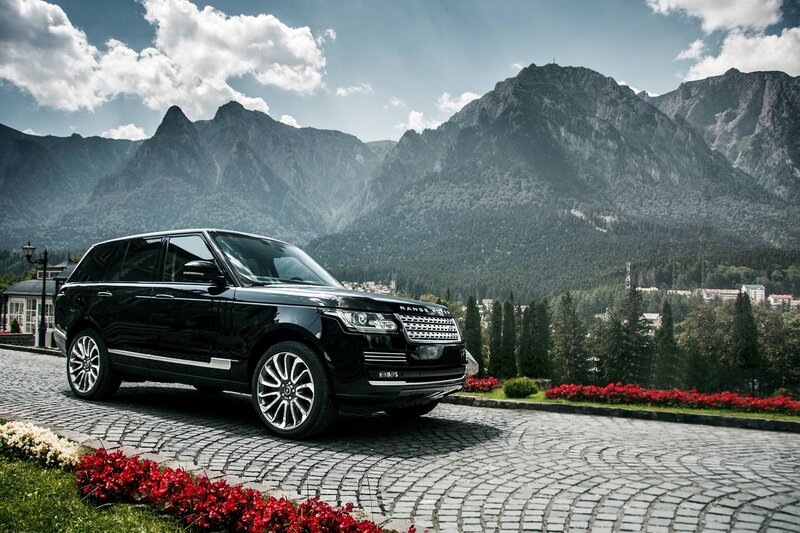 Black Range Rover in mountain setting