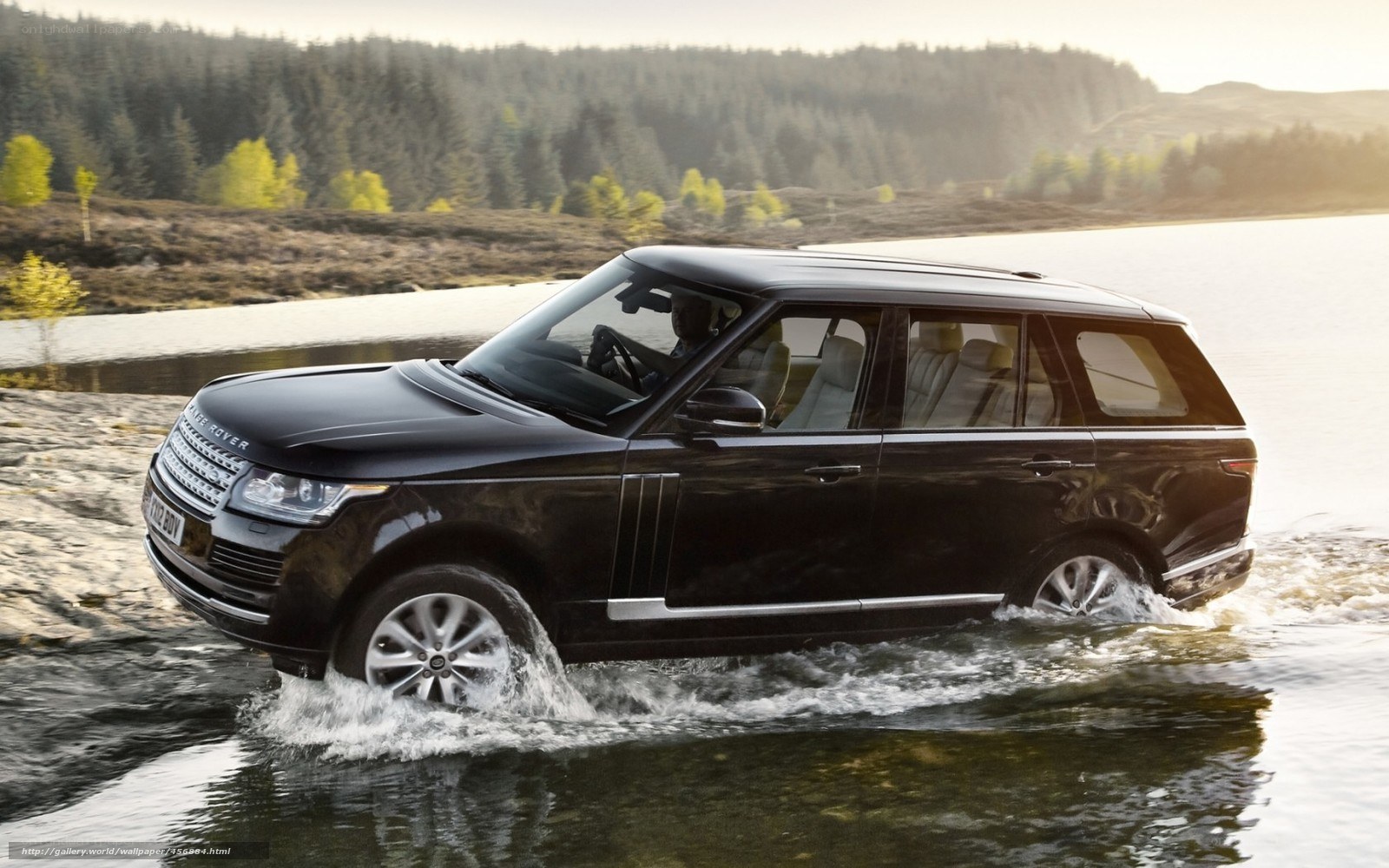 Black Range Rover in water