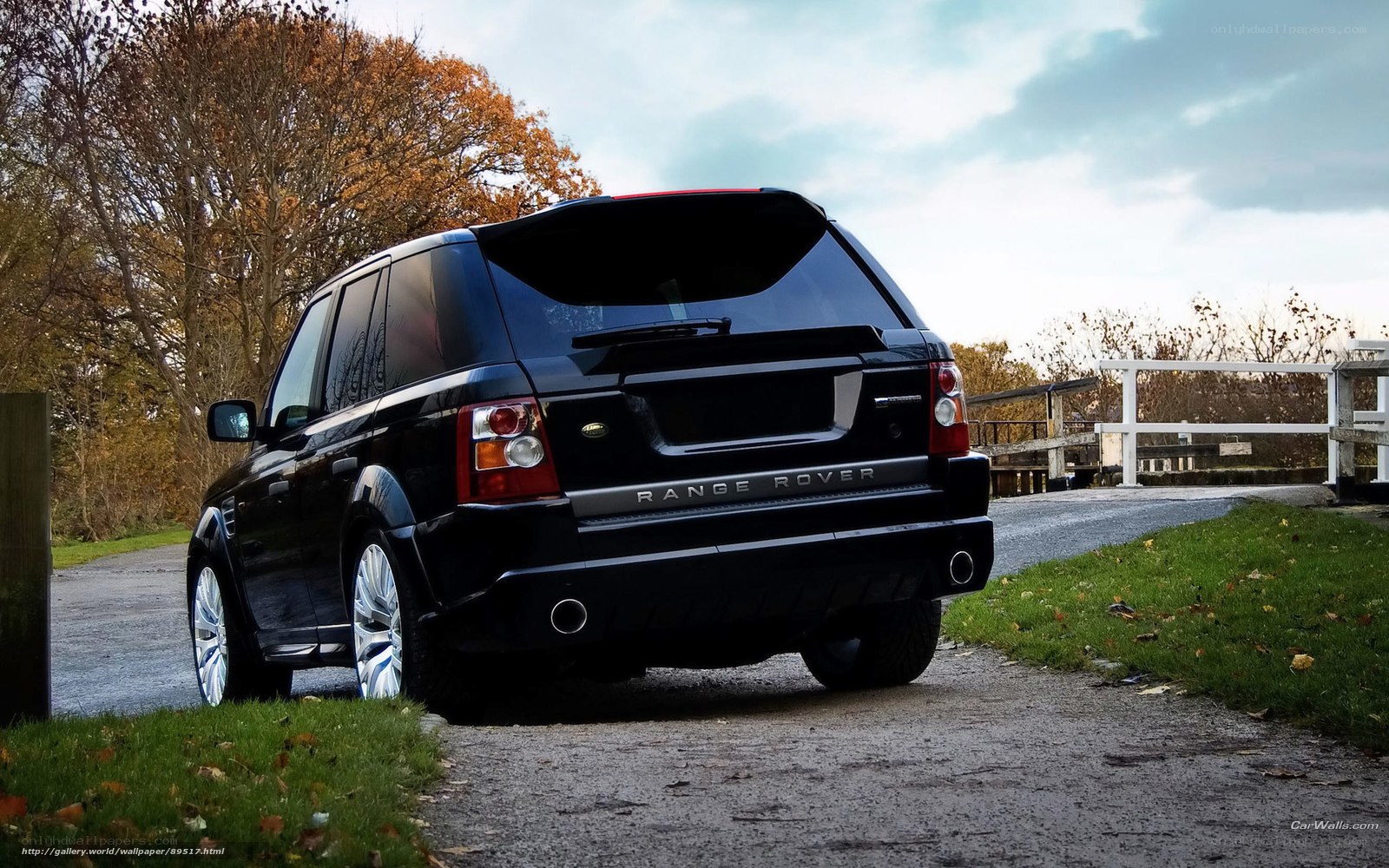Black Range Rover on a country road