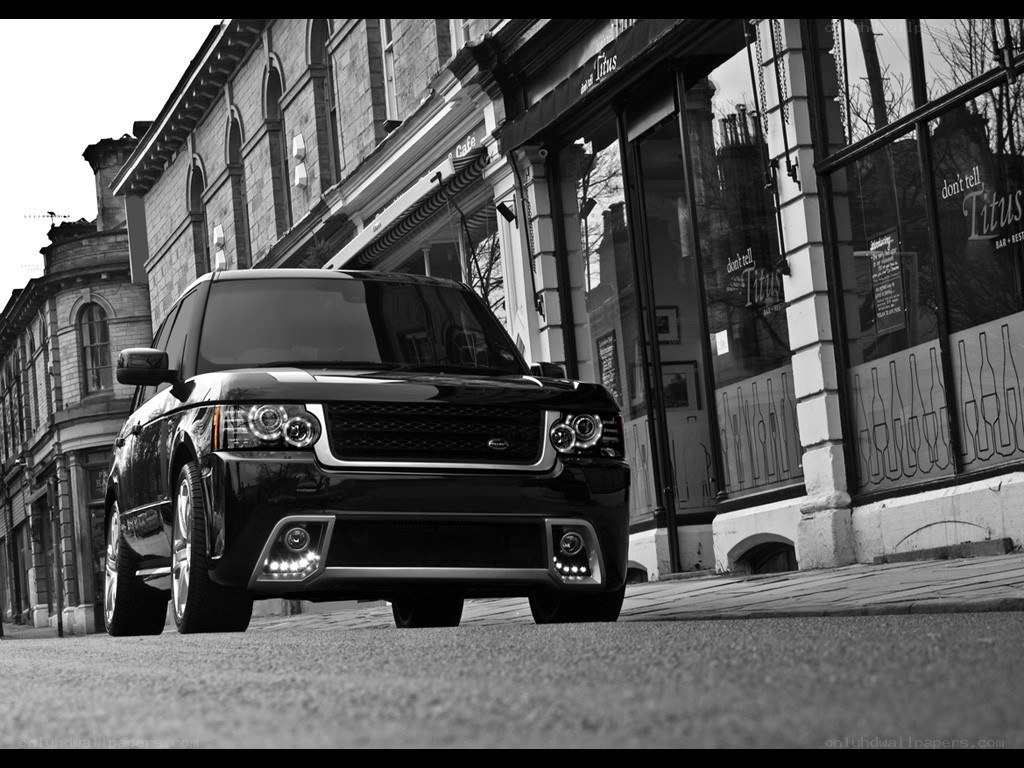 black range rover on city street